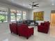 Inviting living room featuring large windows, modern furniture, and stylish decor at 10148 Malpas Pt, Orlando, FL 32832