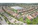 Aerial view of a vibrant community featuring serene lakes and lush greenery at 10203 Henbury St, Orlando, FL 32832