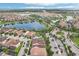 Get a bird's eye view of this community featuring a lake, fountain, palms, and walking trails near shopping and community transit at 10203 Henbury St, Orlando, FL 32832