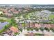 Aerial view showcasing the community with lakes, landscaping, and nearby amenities at 10203 Henbury St, Orlando, FL 32832