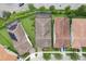 Aerial shot of three homes featuring lush landscaping and tile roofs at 10203 Henbury St, Orlando, FL 32832