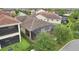 Aerial view of fenced backyard with screened lanai at 10203 Henbury St, Orlando, FL 32832
