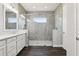 Bathroom featuring a large tiled glass shower with built-in shelving at 10203 Henbury St, Orlando, FL 32832