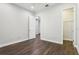 Empty bedroom featuring wood floors, walk-in closet, and bright paint at 10203 Henbury St, Orlando, FL 32832
