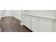 Hallway featuring stylish cabinetry and a neutral color palette, blending utility with aesthetic at 10203 Henbury St, Orlando, FL 32832