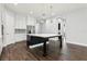 A large kitchen island with stone countertops and stainless steel appliances, ideal for cooking at 10203 Henbury St, Orlando, FL 32832