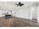 Spacious open-concept living space with wood flooring, lots of light and modern fixtures at 10203 Henbury St, Orlando, FL 32832
