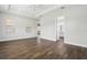 Bright main bedroom featuring tray ceiling, wood-look tile floors, and large windows at 10203 Henbury St, Orlando, FL 32832