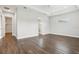 Spacious main bedroom with a tray ceiling, wood-look tile floors, and ensuite bathroom access at 10203 Henbury St, Orlando, FL 32832