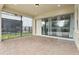 Covered patio with brick pavers and screened in exterior at 10203 Henbury St, Orlando, FL 32832