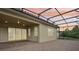 A covered patio with brick flooring, perfect for enjoying the outdoors, with a lovely sky view at 10203 Henbury St, Orlando, FL 32832