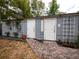 Charming backyard cottage with brick path, cottage sign, and attractive landscaping at 1102 S Oak Ave, Sanford, FL 32771