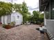 Inviting backyard featuring a brick patio, cottage, and outdoor dining area at 1102 S Oak Ave, Sanford, FL 32771