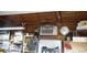 Workshop interior with wood-paneled ceiling, storage solutions, and window AC unit at 1102 S Oak Ave, Sanford, FL 32771