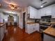 Bright kitchen featuring white cabinets, butcher block counters, and stainless steel appliances at 1102 S Oak Ave, Sanford, FL 32771