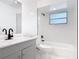 Bathroom featuring shower over tub, toilet and modern vanity with updated faucet at 1113 Leeward Dr, Deltona, FL 32738