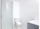 Modern bathroom featuring sleek glass enclosed shower, toilet, and vanity at 1113 Leeward Dr, Deltona, FL 32738
