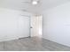 Spacious bedroom featuring modern tile floors, fan and ample closet space at 1113 Leeward Dr, Deltona, FL 32738