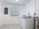 Laundry room with washer and dryer, white walls, tile flooring and a window with horizontal blinds at 1113 Leeward Dr, Deltona, FL 32738