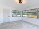 Bright and airy room with modern tile floors and multiple windows at 1113 Leeward Dr, Deltona, FL 32738