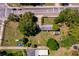 Aerial view of a property featuring mature trees, a house, and a large backyard near a street at 1121 Votaw Rd, Apopka, FL 32703