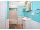 A bathroom highlighted by retro tilework, a single vanity, and a shower-tub combination at 1121 Votaw Rd, Apopka, FL 32703