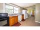 Functional kitchen featuring wooden cabinets, a dishwasher, and white appliances at 1121 Votaw Rd, Apopka, FL 32703
