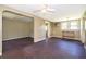 The living room has vintage floors, paneled walls, and a ceiling fan, with an open view to adjacent rooms at 1121 Votaw Rd, Apopka, FL 32703