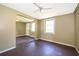 An open-concept space with wood floors, and neutral walls, featuring a ceiling fan for added comfort at 1121 Votaw Rd, Apopka, FL 32703