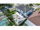 An aerial view shows a large backyard with a patio, pool, lawn, and fencing offering outdoor enjoyment and privacy at 11257 Dacre Ln, Orlando, FL 32824