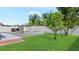 Spacious backyard featuring a large patio, lush lawn, and privacy fence, perfect for outdoor enjoyment and recreation at 11257 Dacre Ln, Orlando, FL 32824