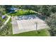 The image shows a basketball court with a full court, two hoops, and a nearby shaded picnic area at 11257 Dacre Ln, Orlando, FL 32824