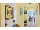 Hallway with arched doorway, yellow walls, and tile flooring at 11257 Dacre Ln, Orlando, FL 32824