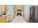 Spacious kitchen with stainless steel appliances, white cabinets and center island at 11257 Dacre Ln, Orlando, FL 32824