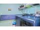 Convenient laundry room with modern washer and dryer, ample storage, and efficient layout for easy laundry tasks at 11257 Dacre Ln, Orlando, FL 32824