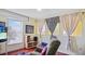 The living room features comfortable seating, decorative windows, and a modern entertainment center for an inviting experience at 11257 Dacre Ln, Orlando, FL 32824