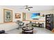 Inviting living room featuring a TV, display shelf, tile flooring, and cozy seating at 11257 Dacre Ln, Orlando, FL 32824