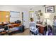 Bright office featuring dual desk areas, a window, and ample storage at 11257 Dacre Ln, Orlando, FL 32824