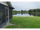 Scenic backyard view features a tranquil pond surrounded by lush greenery at 11373 Darlington Dr, Orlando, FL 32837