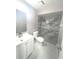 Updated bathroom featuring stylish vanity, modern toilet, and newly tiled shower with glass at 11373 Darlington Dr, Orlando, FL 32837