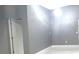 This bedroom features a modern design with grey walls and neutral floors at 11373 Darlington Dr, Orlando, FL 32837