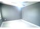 Cozy bedroom featuring gray walls, white tile floor, and a ceiling fan at 11373 Darlington Dr, Orlando, FL 32837