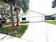 Attractive one-story home with well-kept lawn and palm trees at 11373 Darlington Dr, Orlando, FL 32837