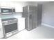 Clean kitchen featuring stainless steel appliances, white cabinets and light colored walls at 11373 Darlington Dr, Orlando, FL 32837
