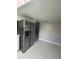 Bright kitchen with stainless steel refrigerator and expansive tile flooring at 11373 Darlington Dr, Orlando, FL 32837