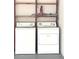 Image of the laundry machines and utility shelving in the laundry room at 11373 Darlington Dr, Orlando, FL 32837