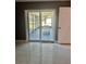 Patio view features a sliding glass door and white cushioned patio furniture at 11373 Darlington Dr, Orlando, FL 32837