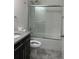 Bathroom features a shower-tub, granite vanity and modern toilet at 11464 Center Lake Dr, Windermere, FL 34786