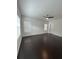 Spacious bedroom with dark wood floors, ceiling fan, and bright windows at 11464 Center Lake Dr, Windermere, FL 34786
