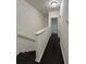 Hallway with hardwood flooring and stairwell leading to multiple rooms, lit by modern ceiling light at 11464 Center Lake Dr, Windermere, FL 34786